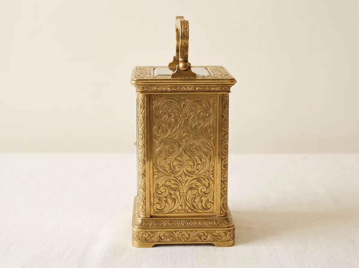 Side of a carriage clock case covered in hand-engraved foliate scrolls