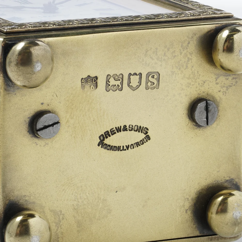 Underside of a silver-gilt carriage clock with London hallmarks for 1913 and the Drew and Sons Piccadilly Circus stamp