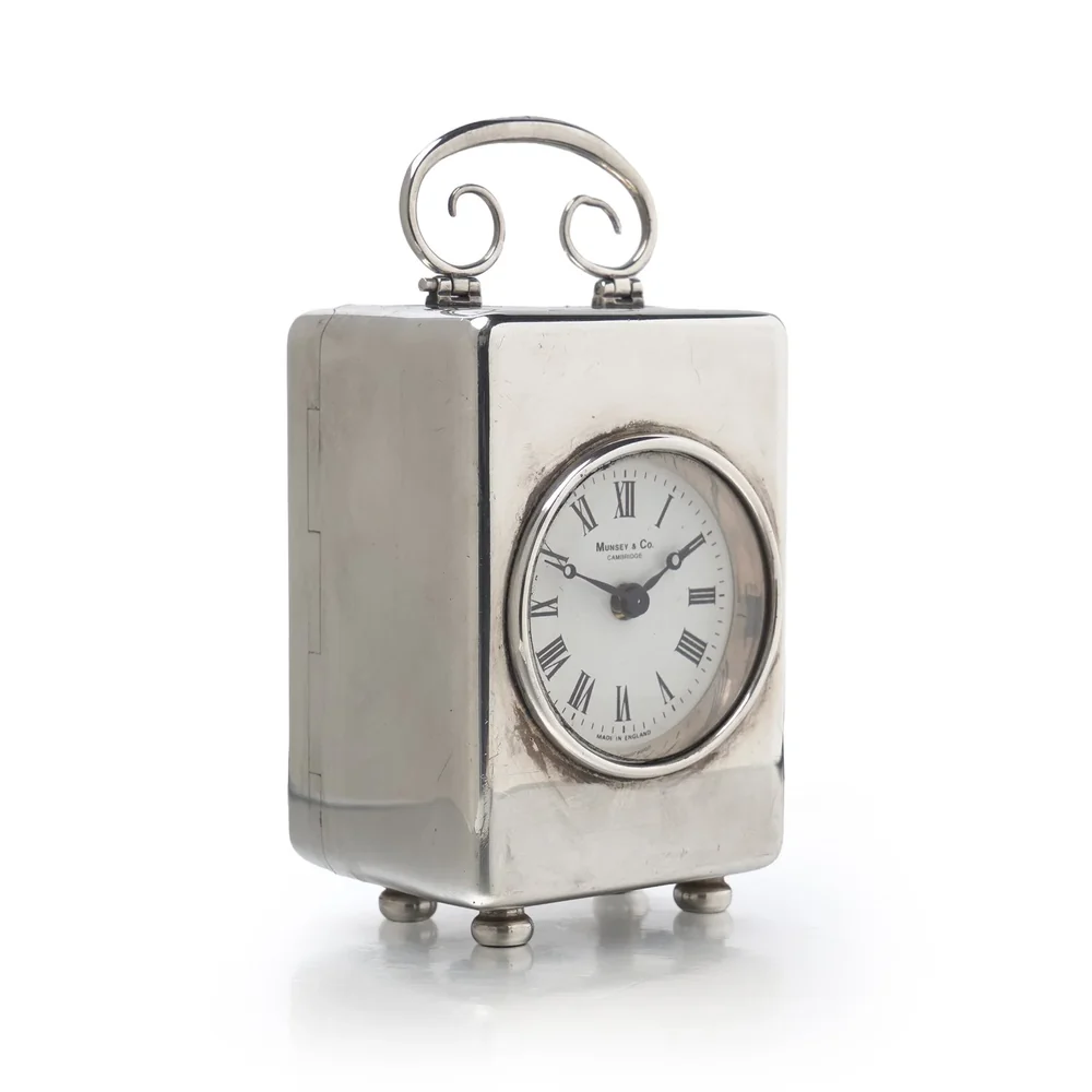 Vintage sterling silver miniature carriage clock, London 1988, with scroll handle, ball feet and round white dial