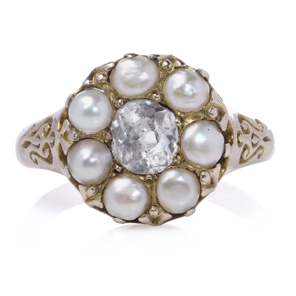 Antique 9ct gold cluster ring with an old mine cut diamond inside seven natural pearls