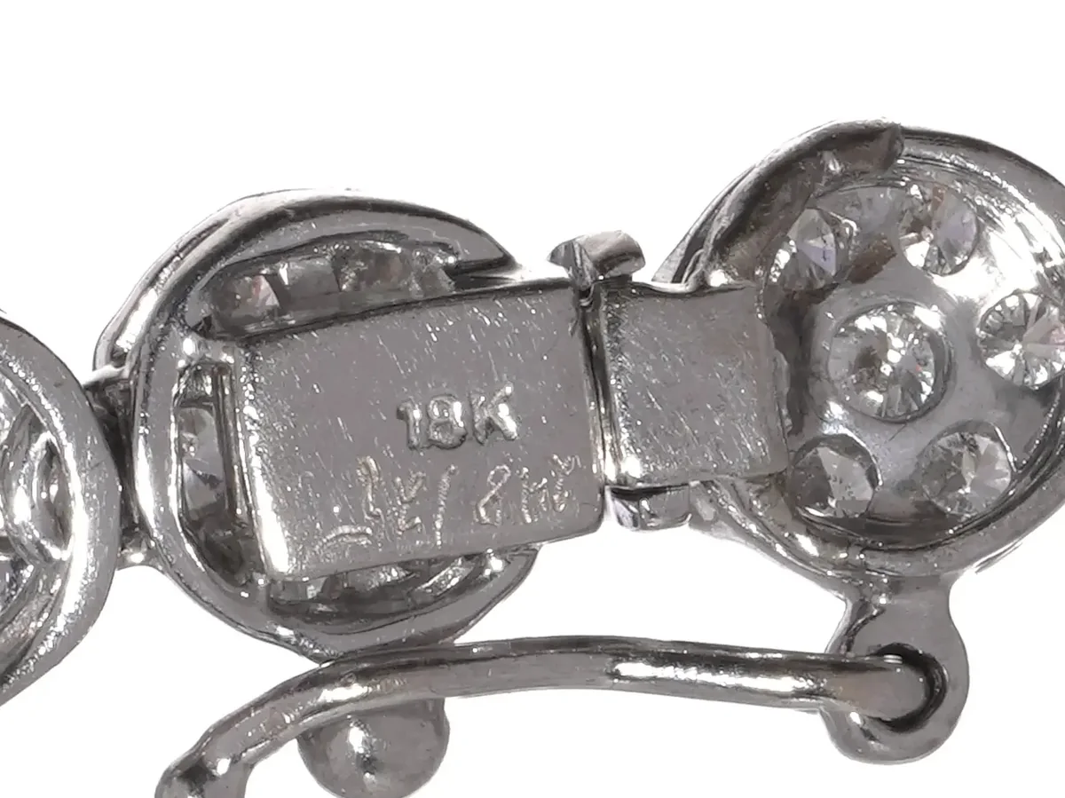A marked box clasp with a side safety catch on a white gold diamond necklace