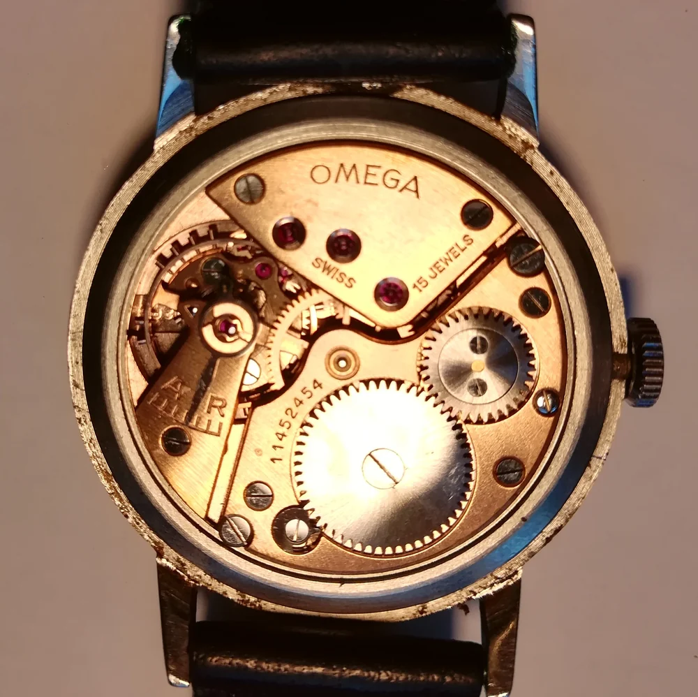 An Omega calibre 30T2 manual wind movement of the late 1940s, signed Omega, Swiss, 15 jewels, seen through an open steel case back