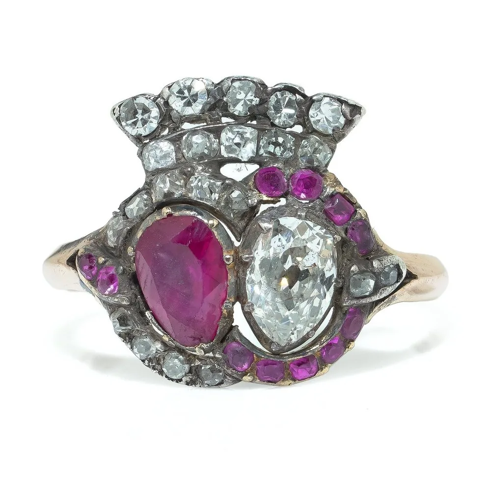 Georgian gold ring with a ruby and a diamond set side by side beneath a diamond crown