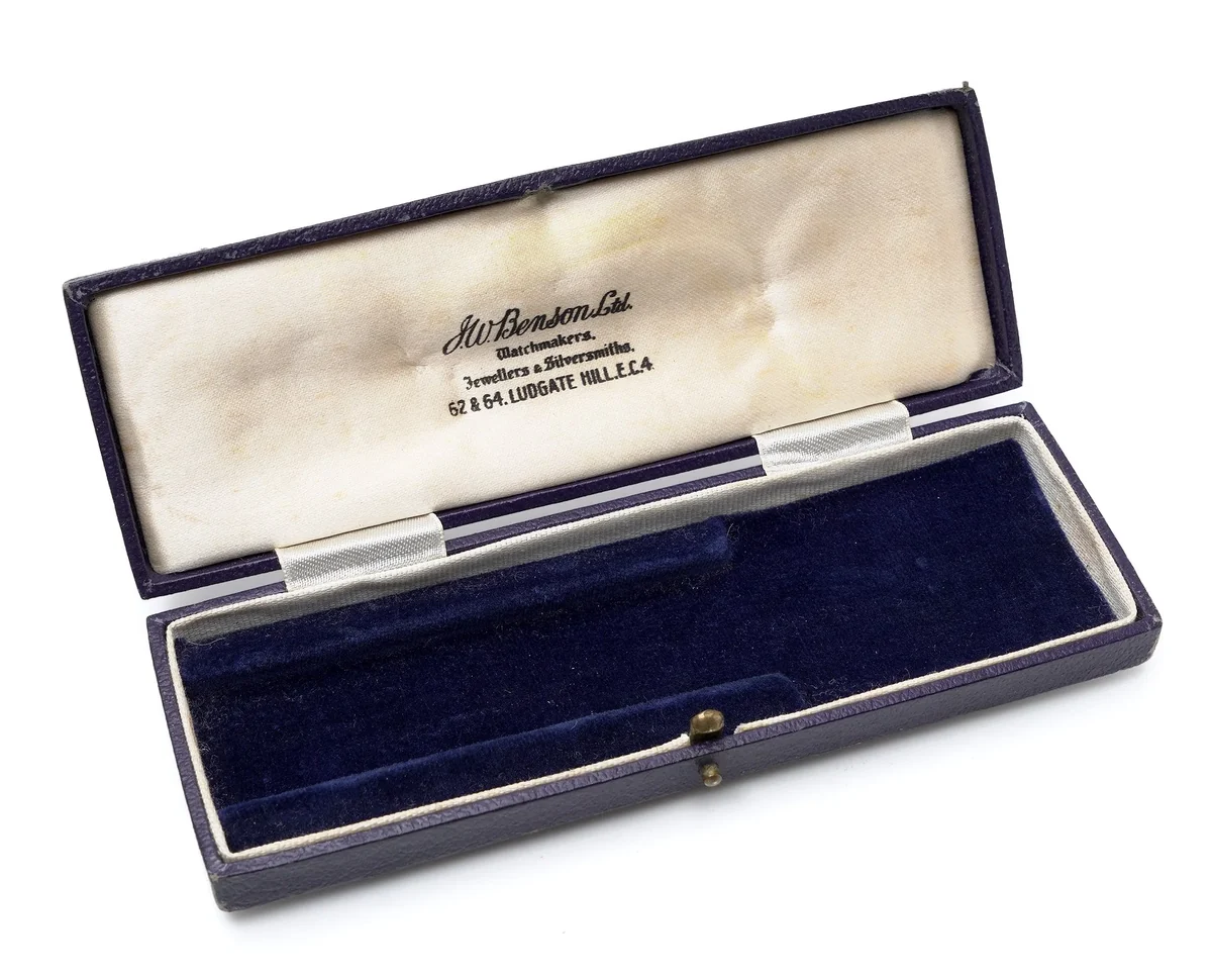 Antique J.W. Benson Ltd box in blue leather, open, the cream satin lid printed Watchmakers, Jewellers and Silversmiths, 62 and 64 Ludgate Hill, E.C.4