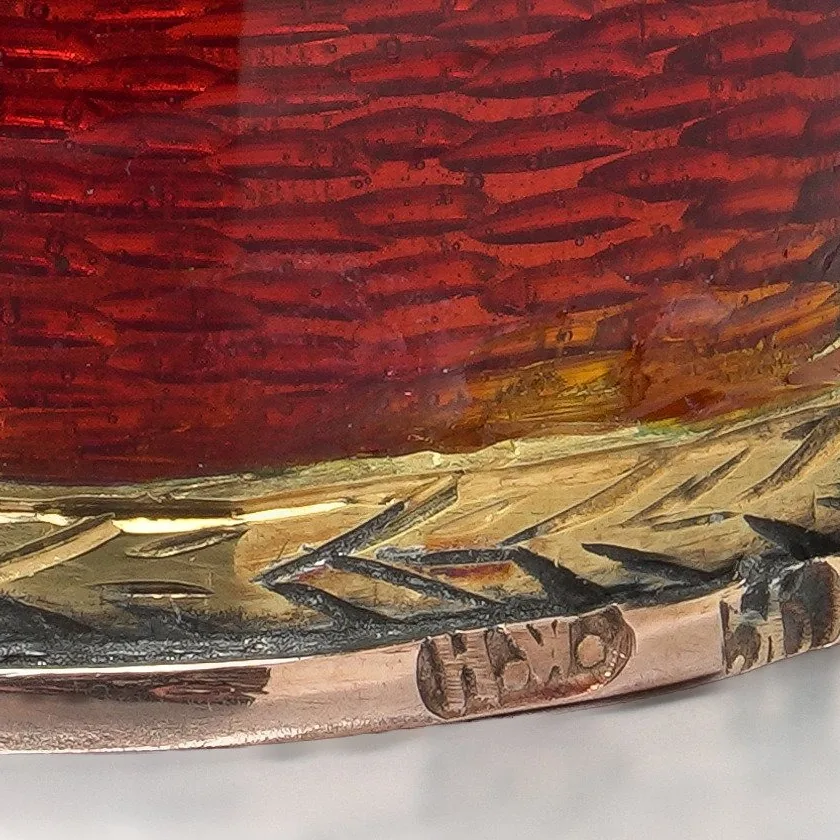 Close-up of the rim of the Russian gold thimble struck with the workmaster's initials HW in an oval, beside a worn second mark
