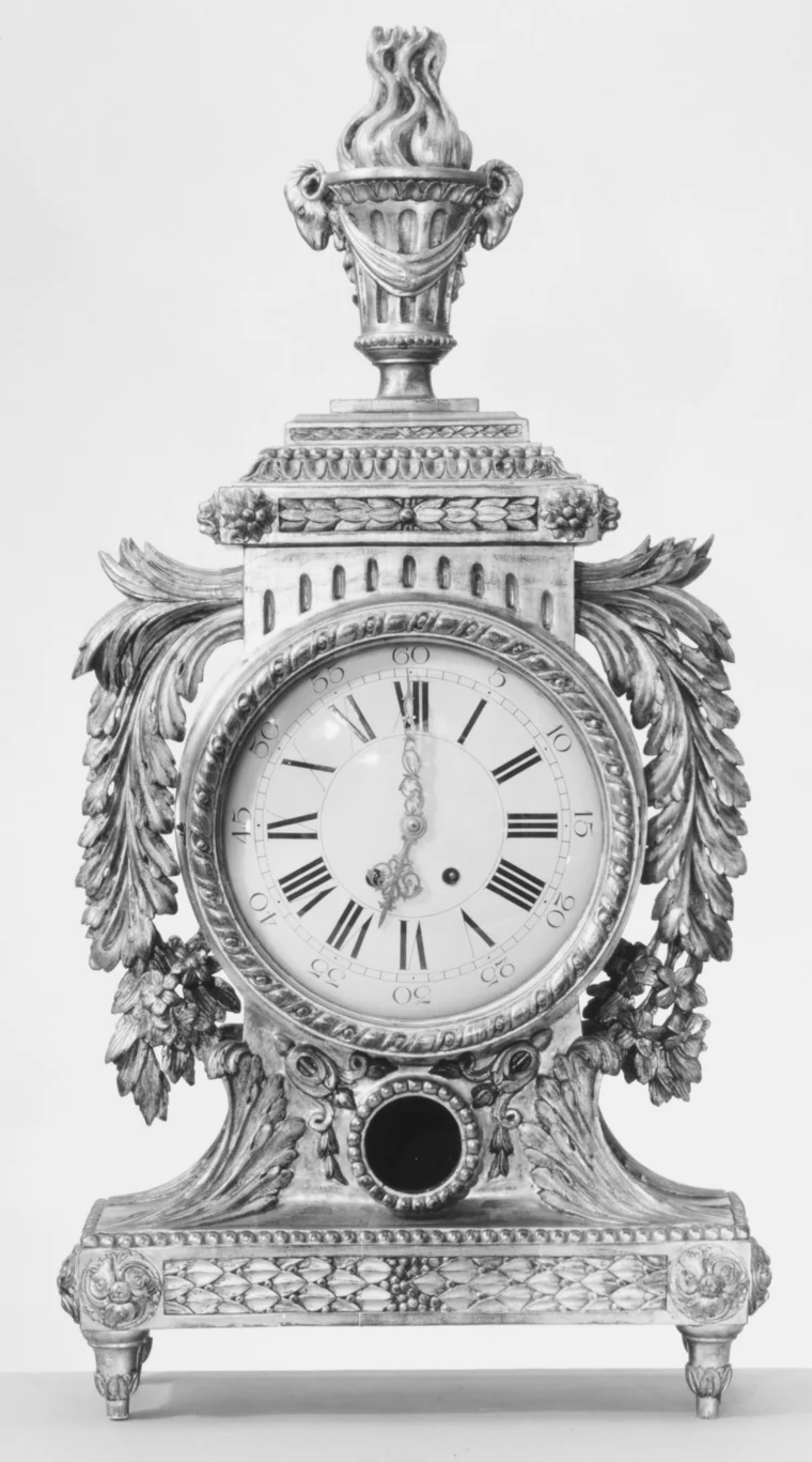 Louis XVI style carved and gilded mantel clock with a flaming urn finial, case about 1770, fitted with a Samuel Marti et Cie movement of about 1860 to 1890