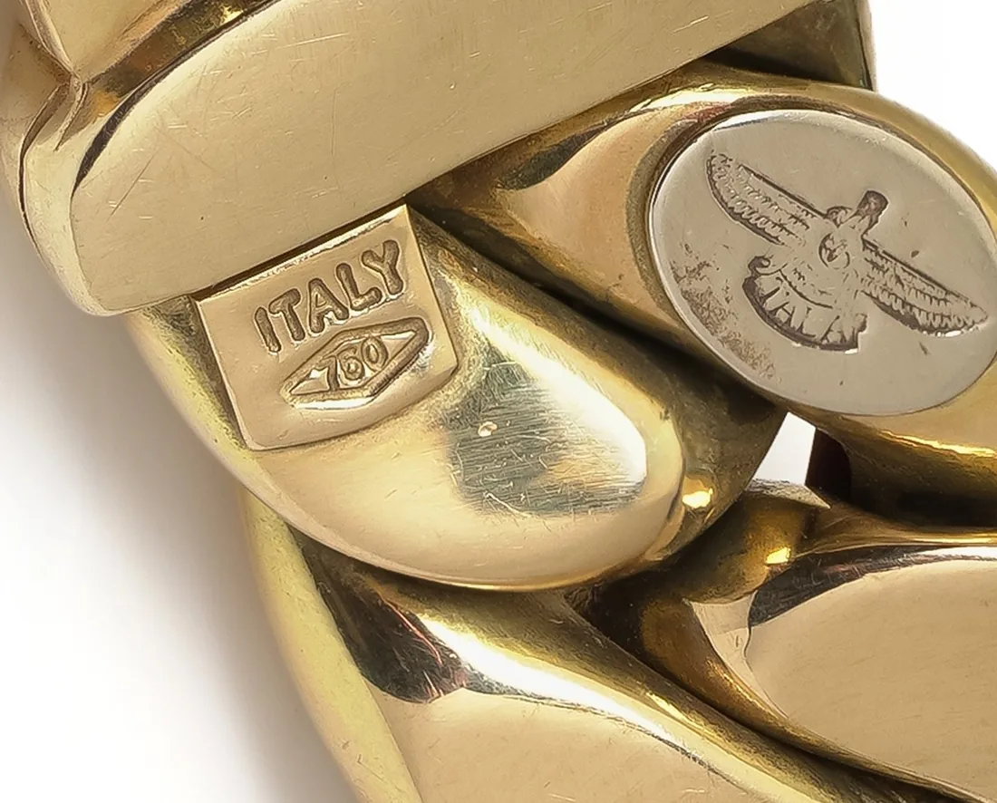 ITALY and 750 marks with the maker's emblem on an 18KT gold Italian curb link bracelet, from our collection