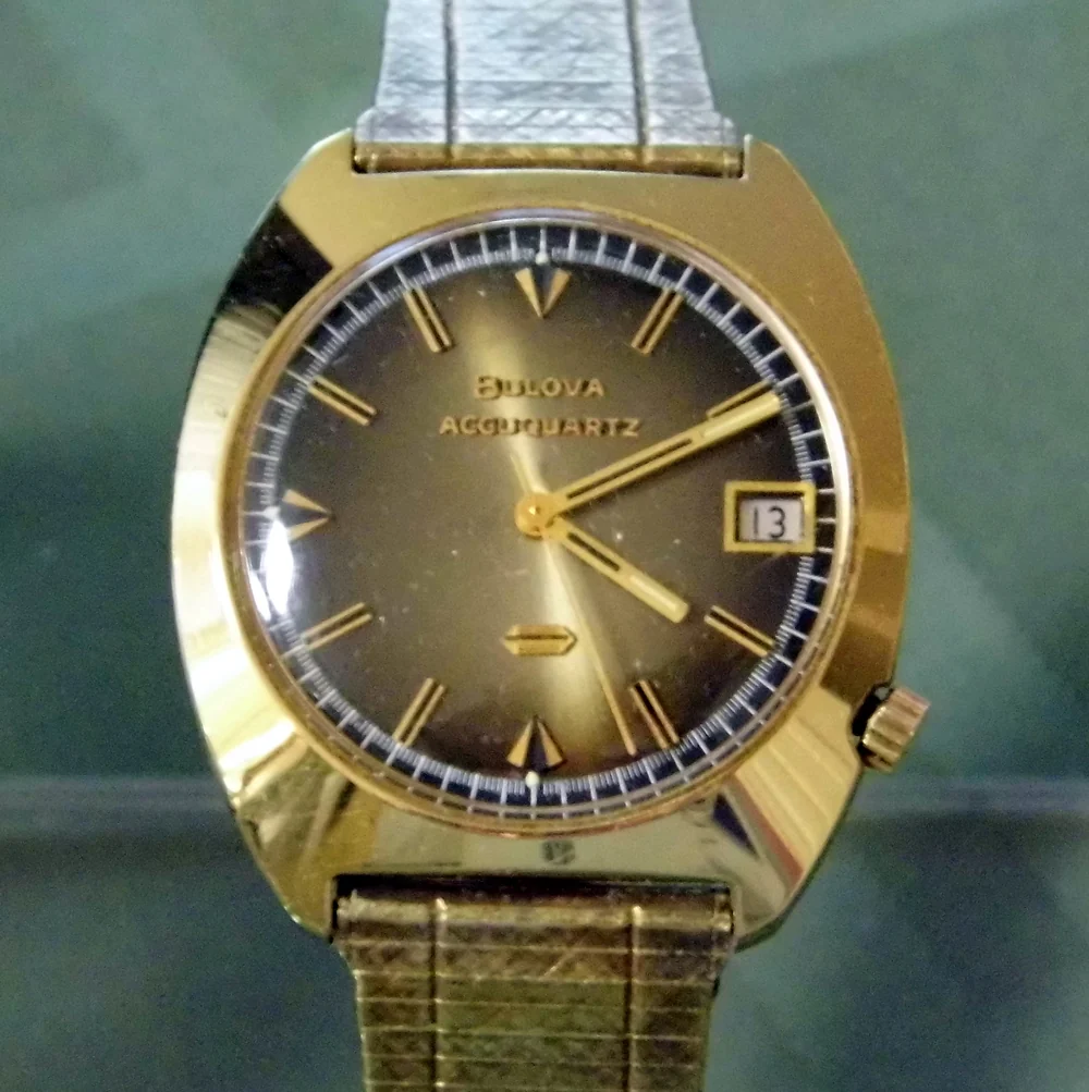 A 1970s Bulova Accuquartz wristwatch with a gold electroplate bezel and a 10K rolled gold plate case back