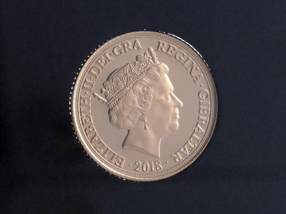 The portrait side of a 2018 proof half sovereign, Gibraltar issue, with the legend ending GIBRALTAR and the date 2018