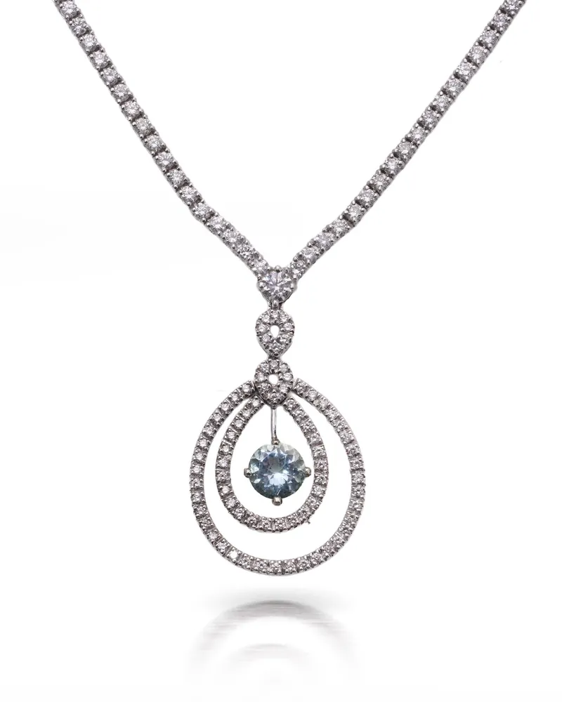 Vintage 18KT white gold necklace set with diamonds and an aquamarine drop