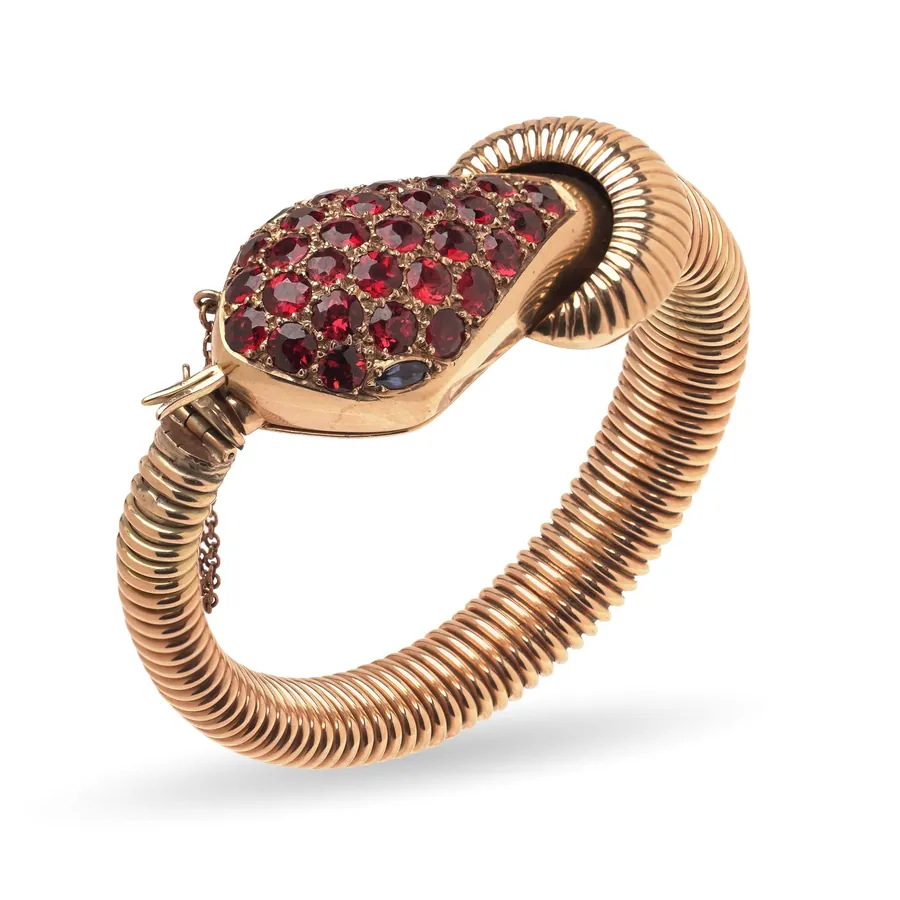Rose-toned 9KT gold snake bracelet watch set with garnets, circa 1950s