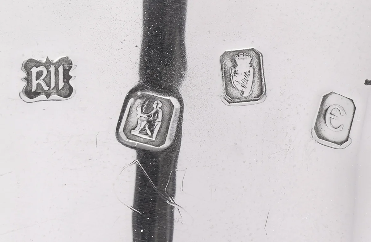 Dublin hallmark on a silver stirrup cup: sponsor's mark RI, the seated figure of Hibernia, the crowned harp and the date letter for 1972