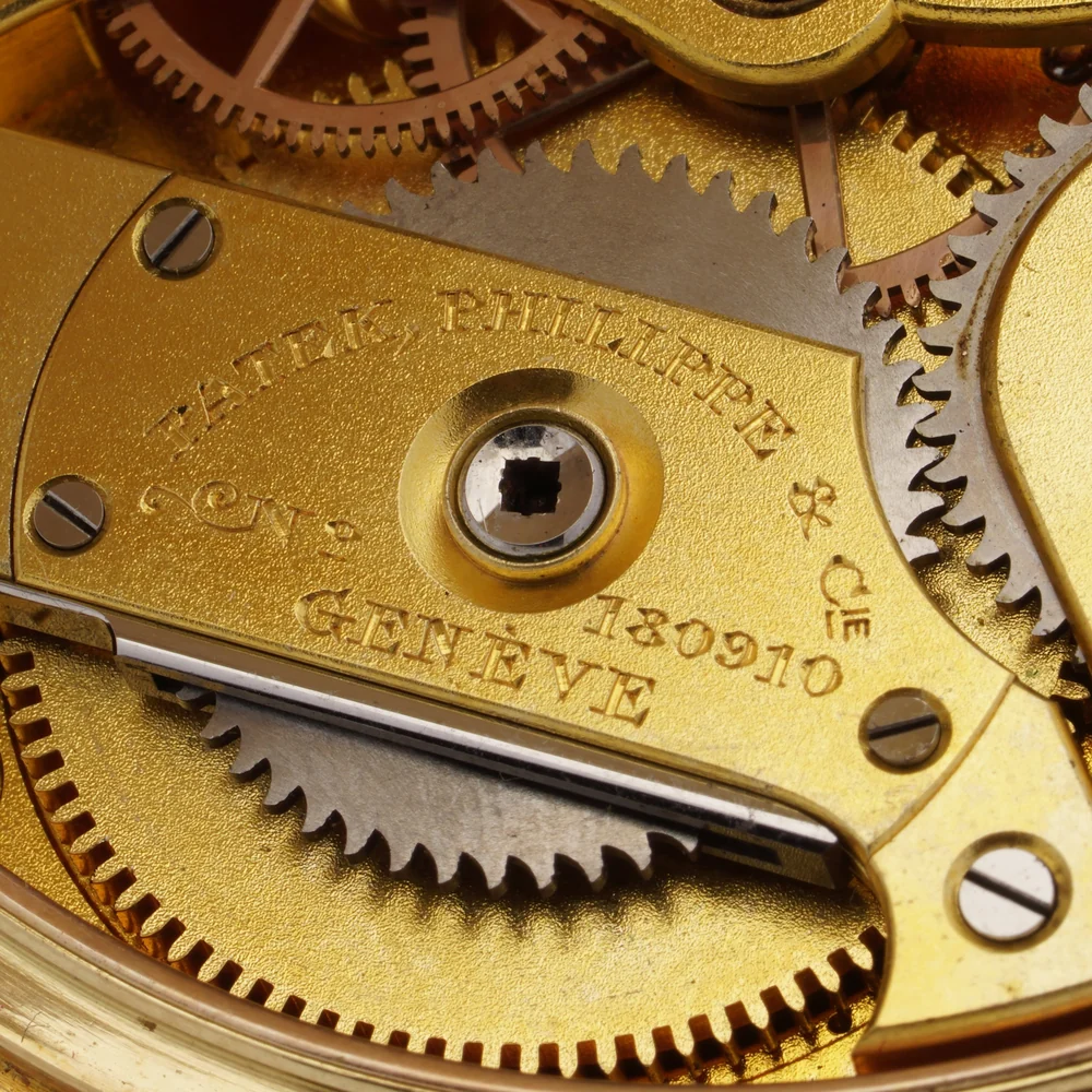 Patek Philippe & Cie Geneve movement number 180910 engraved on the barrel bridge of a gold pocket watch