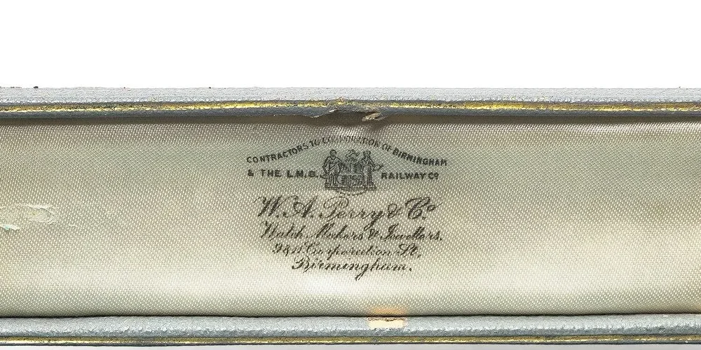 The satin lid of a W.A. Perry & Co watch or bracelet box printed Contractors to the Corporation of Birmingham and the L.M.S. Railway Co, Watch Makers and Jewellers, Corporation St, Birmingham