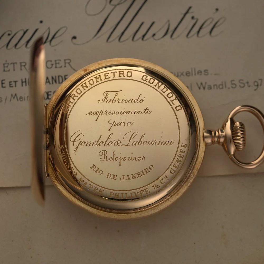 Open case back of a gold Patek Philippe Chronometro Gondolo pocket watch showing the engraved inner dome