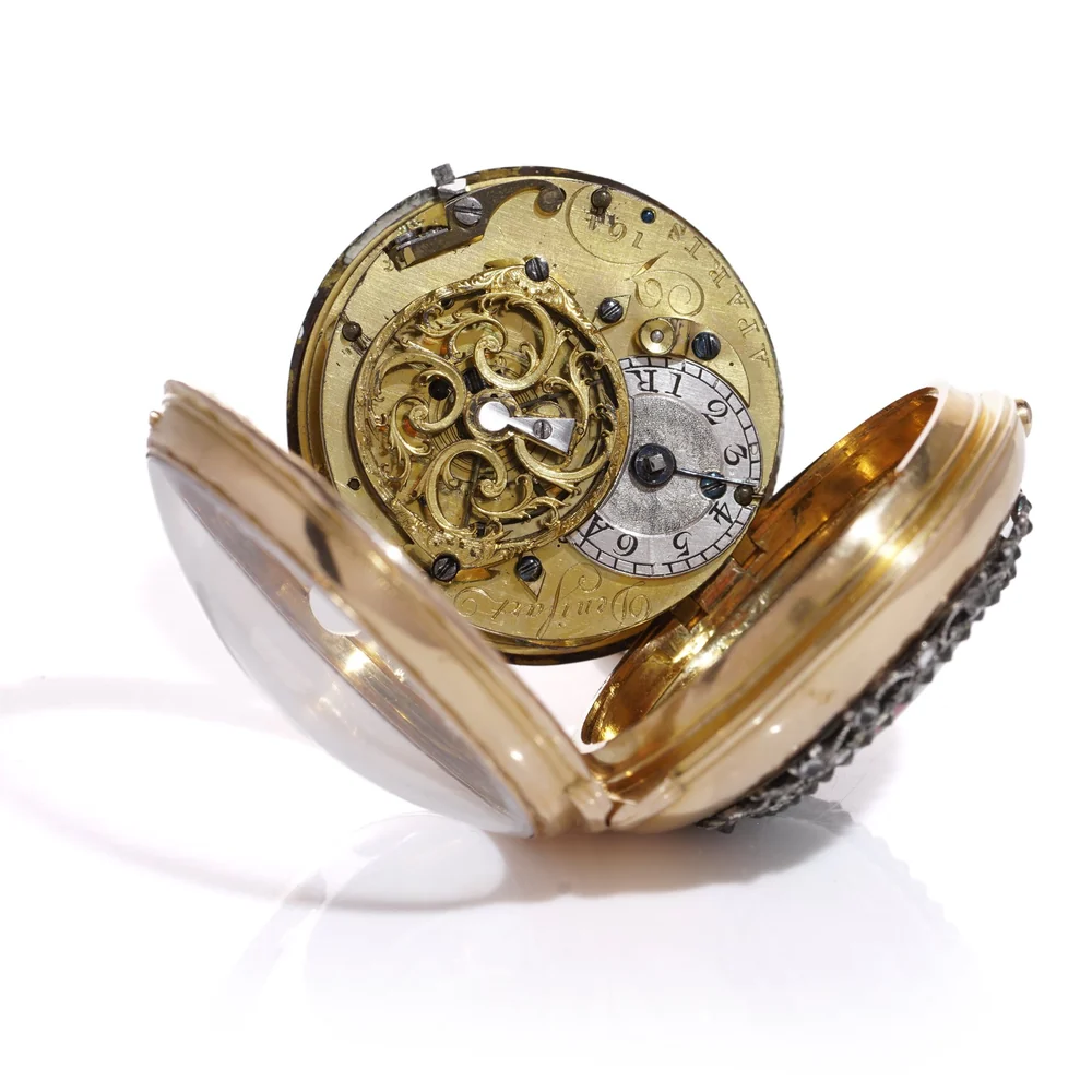 18th century verge pocket watch with the movement swung out of the case on its hinge, showing the pierced balance cock