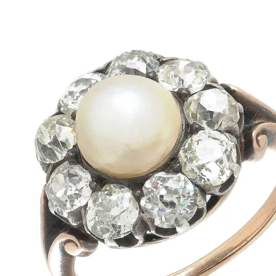 Victorian cluster ring with a natural pearl surrounded by old European cut diamonds