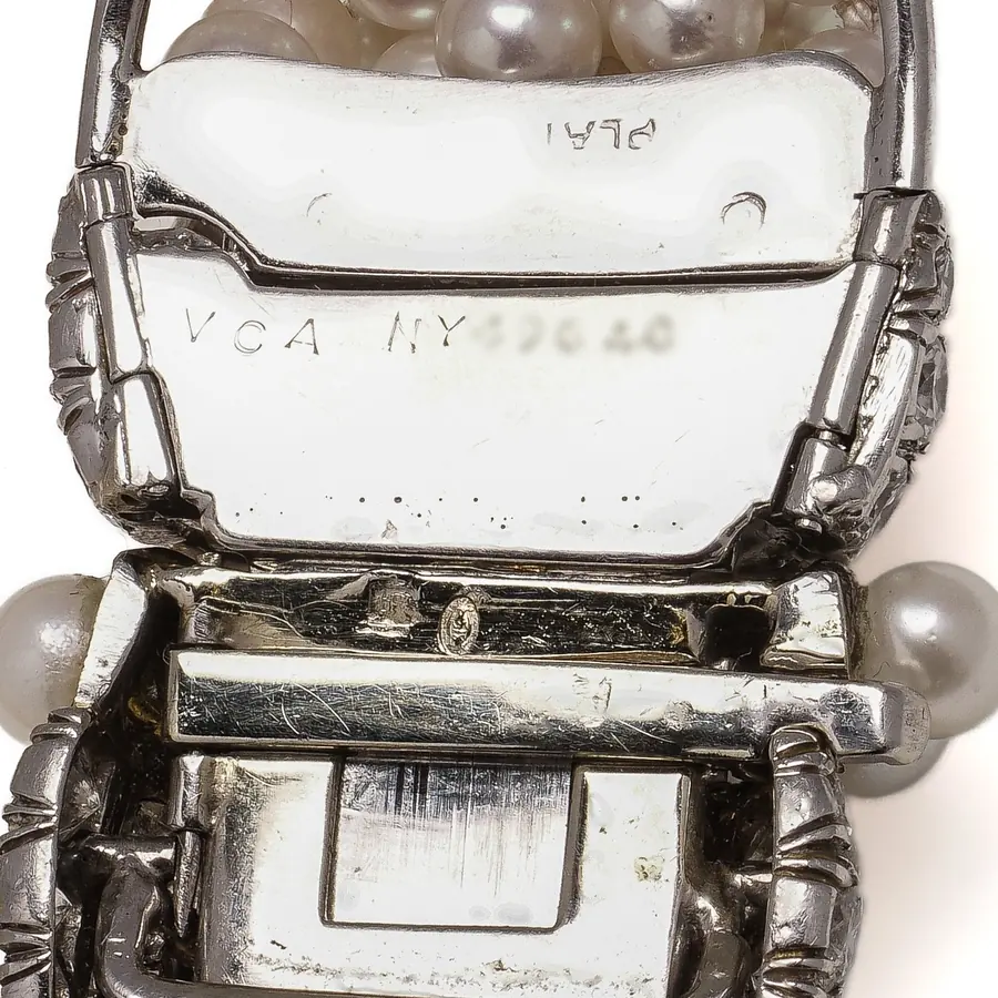 Clasp of a Van Cleef & Arpels pearl and diamond bracelet stamped VCA NY with its serial number and PLAT