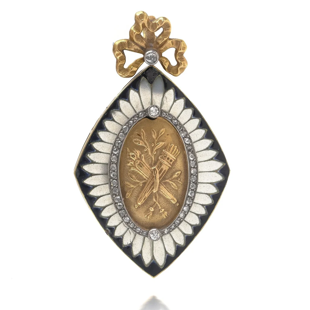 A Victorian 18ct gold locket of marquise shape with white enamel petals on a black enamel ground, rose cut diamonds around a gold panel of a torch and quiver, under a gold bow