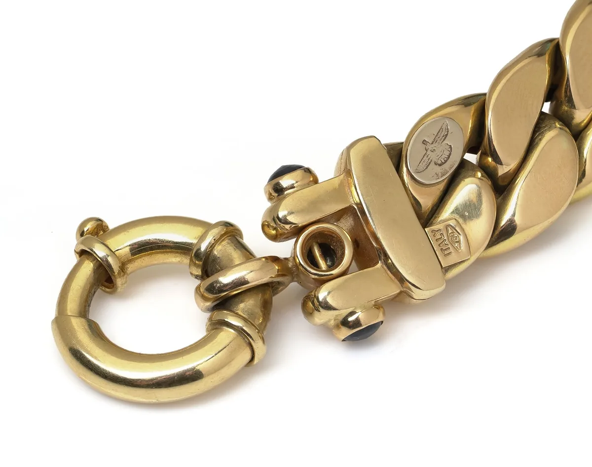 Large bolt ring clasp on an 18KT gold Italian curb link bracelet, with the maker's mark on the end link