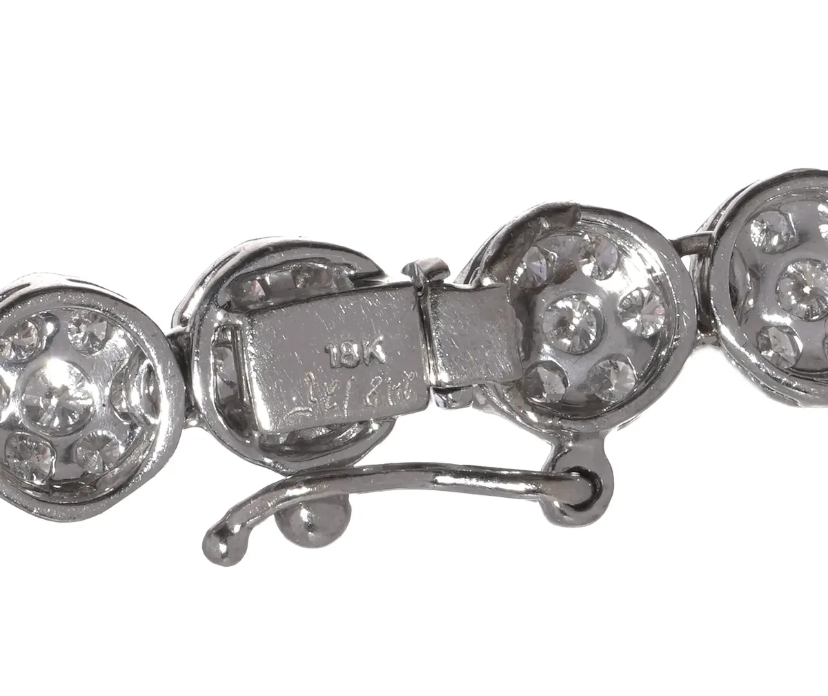 Box clasp stamped 18K with a hinged side safety catch, on an 18KT white gold diamond necklace