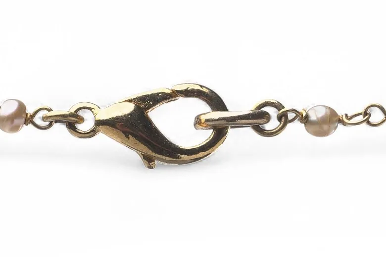 Later lobster claw clasp fitted to a 15KT gold and seed pearl necklace