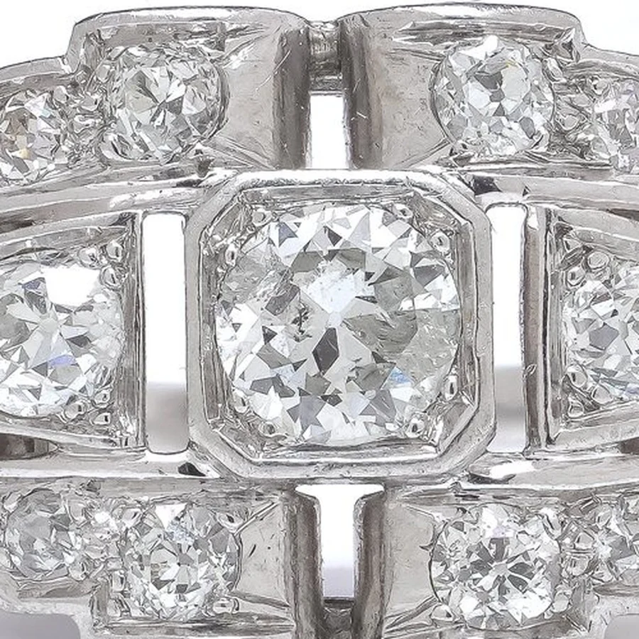 Close-up of an old European cut centre diamond in a square platinum setting, with broad facets