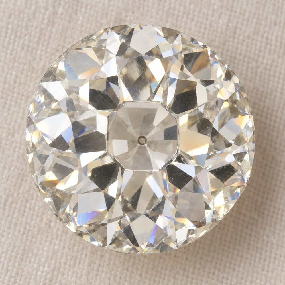 Illustration of an old European cut diamond face up, showing the small table and the open culet as a dot