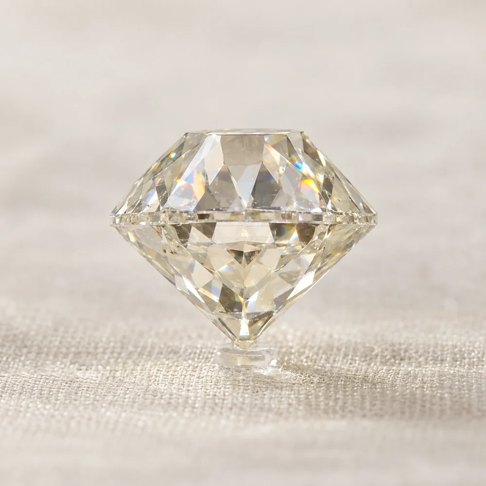 Illustration of an old European cut diamond in profile, with a tall crown and deep pavilion