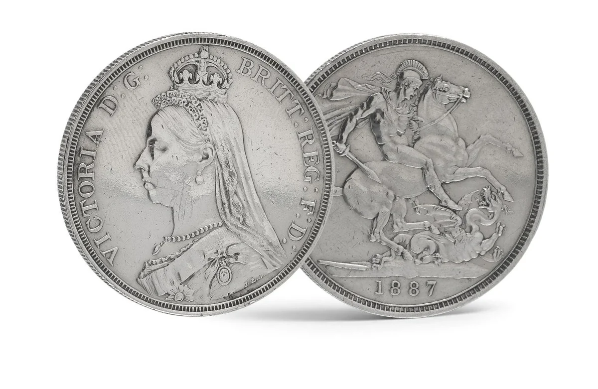 Both sides of an 1887 Queen Victoria Jubilee head silver crown: the crowned portrait and St George slaying the dragon