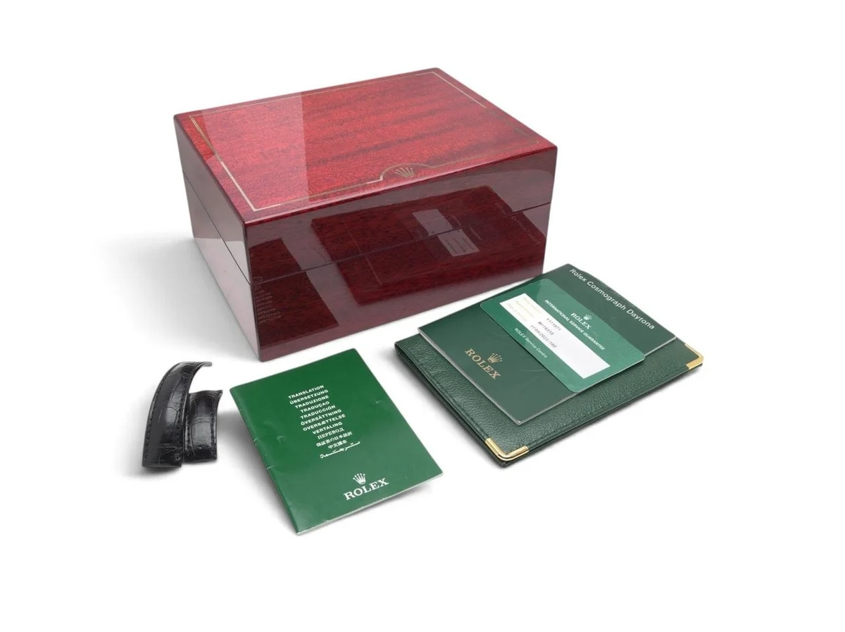 Rolex Daytona 116519 box set: red wooden box, green Rolex papers, manuals and a spare strap section