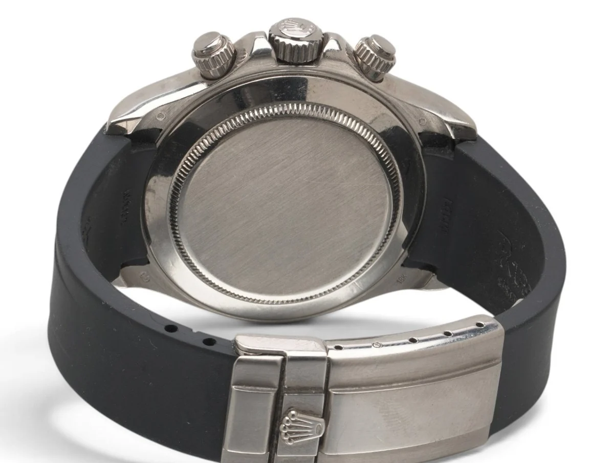Plain, smooth screw-down caseback of a white gold Rolex Daytona 116519 with its folding clasp