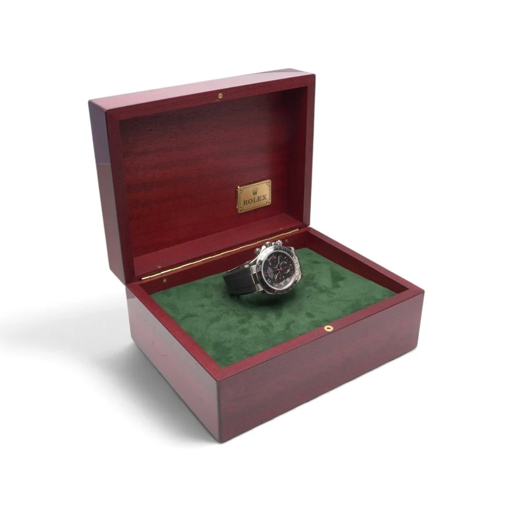 Rolex Daytona 116519 in white gold resting in its open red wooden Rolex presentation box