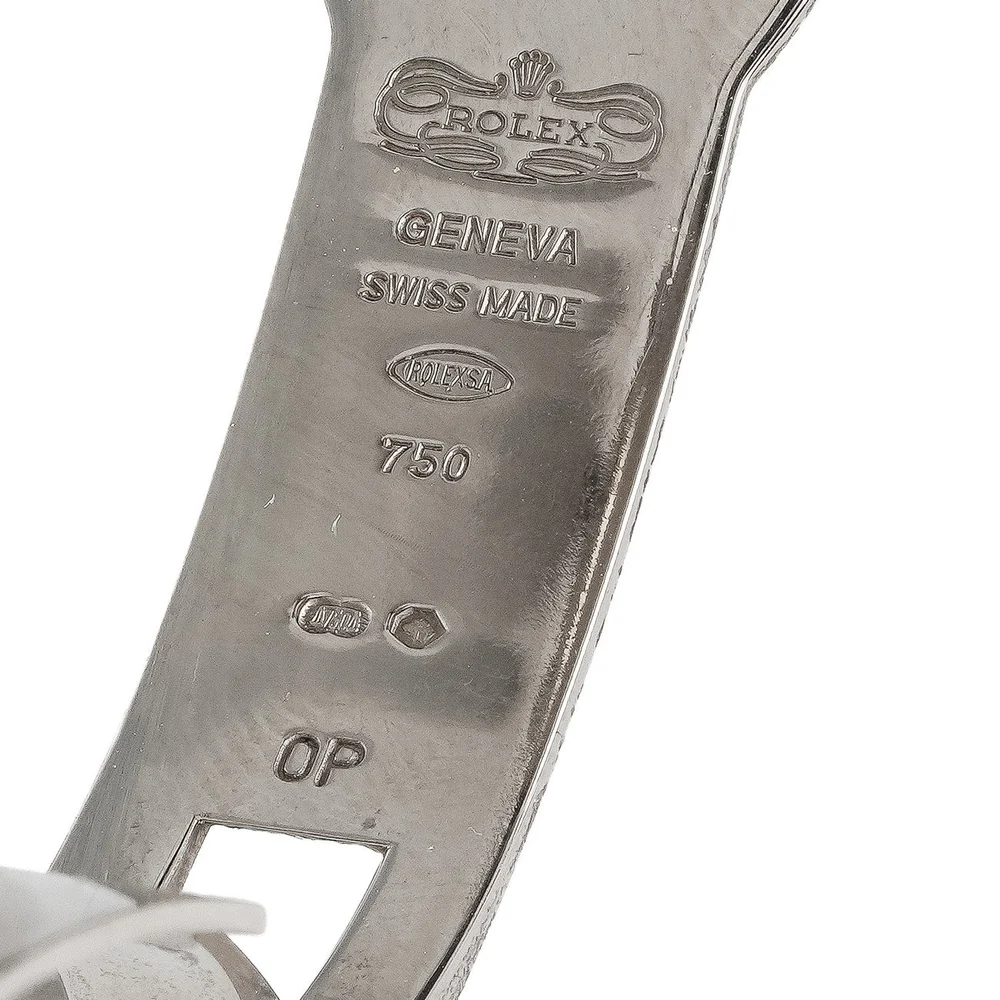 Inside of a Rolex white gold folding clasp stamped with the Rolex crown cartouche, Geneva Swiss Made, 750 and Swiss gold hallmarks