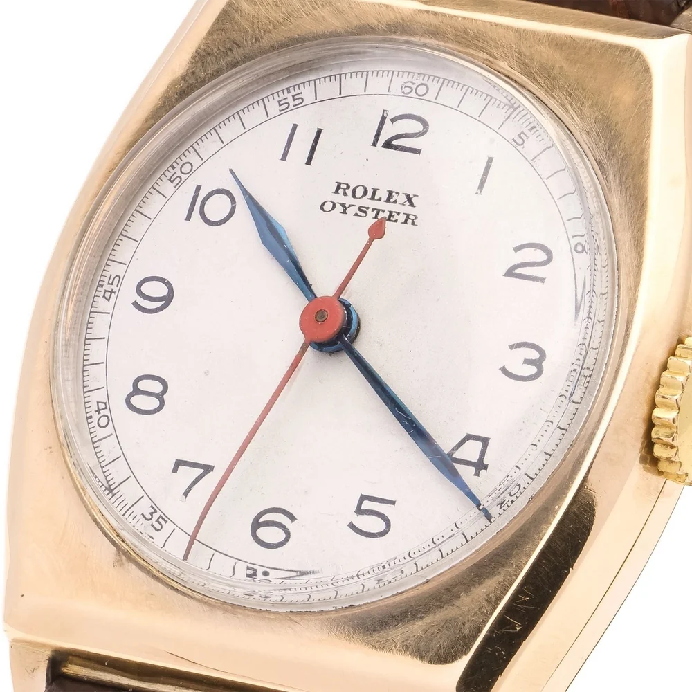 Dial of a 1945 Rolex Oyster in 9ct rose gold with Arabic numerals and blue steel hands, from the Mozeris collection