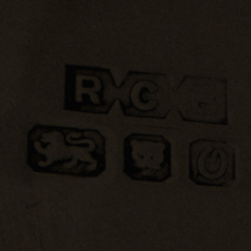 The same hallmarks photographed in poor light, too dark to read