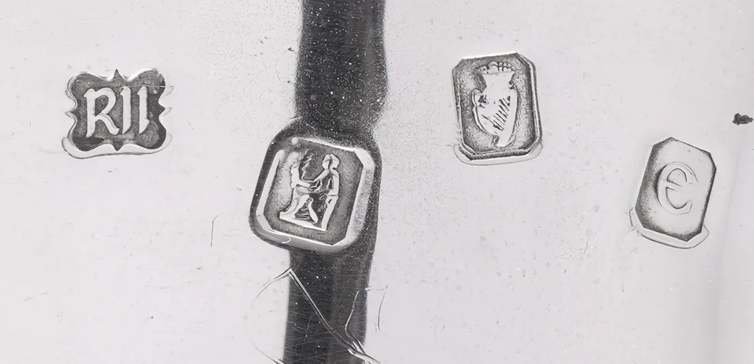 Dublin hallmarks on a 1972 Royal Irish Silver stirrup cup: sponsor's mark, Hibernia, the crowned harp and the date letter