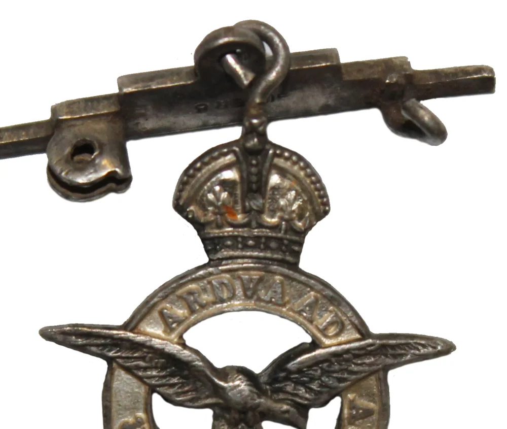 A Second World War silver Royal Air Force sweetheart brooch: an eagle under a crown inside a circle lettered PER ARDVA AD ASTRA, hanging from a bar