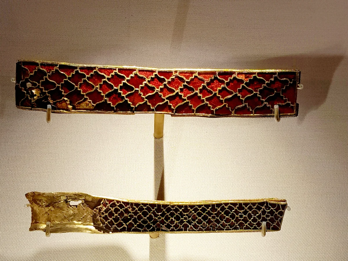 Two Anglo-Saxon gold strips set with red garnet cloisonné in a lattice pattern, from the Staffordshire Hoard