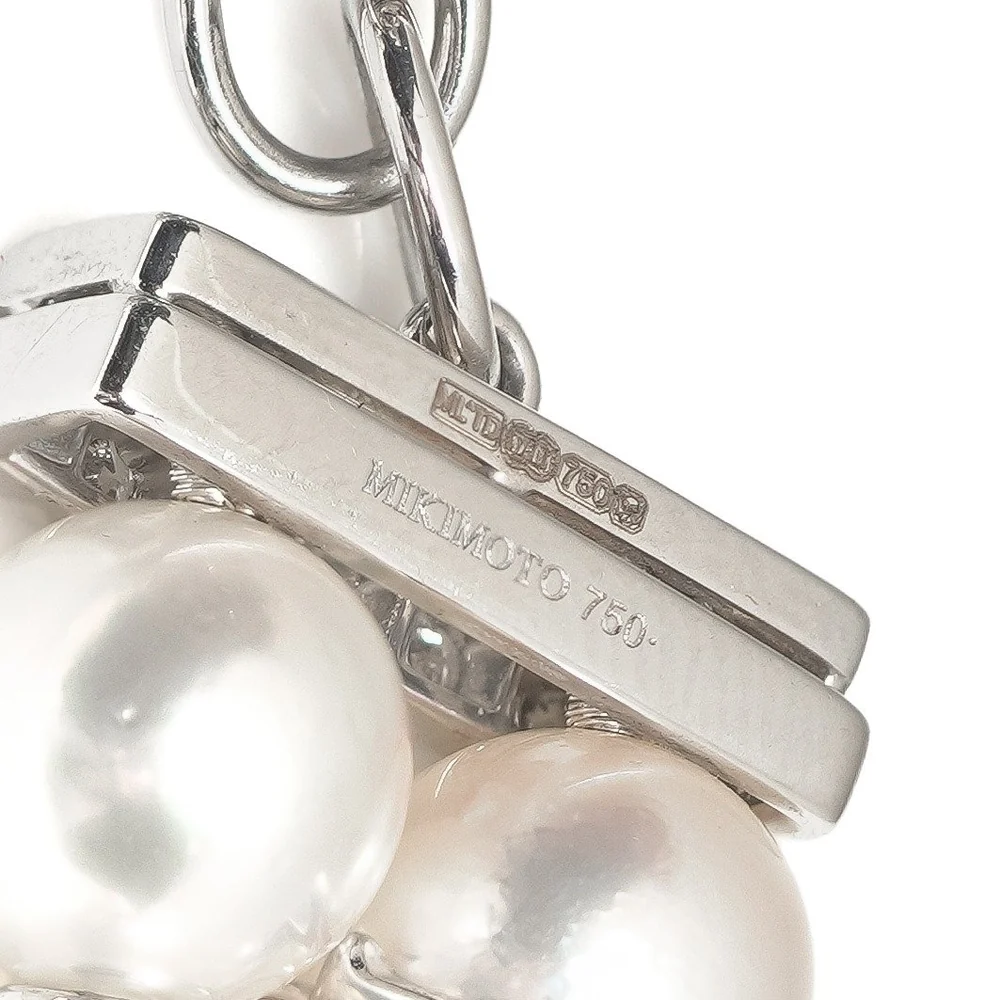 White gold Mikimoto pearl necklace clasp stamped MIKIMOTO 750, with a British hallmark including a crown and 750