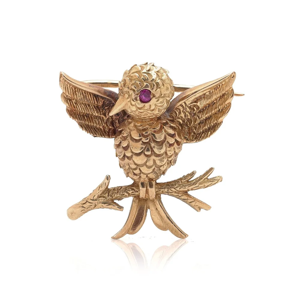 Boucheron Paris 18KT gold bird brooch with a ruby eye, circa 1920s