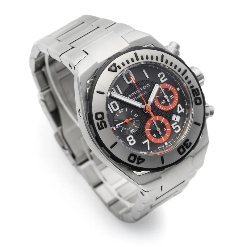 Watch case and bezel photographed at an angle to show condition, Hamilton Khaki Navy Sub chronograph