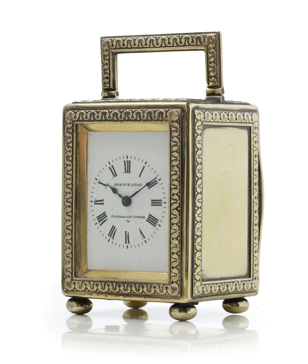 An Edwardian silver-gilt carriage clock by Drew and Sons, London, 1913