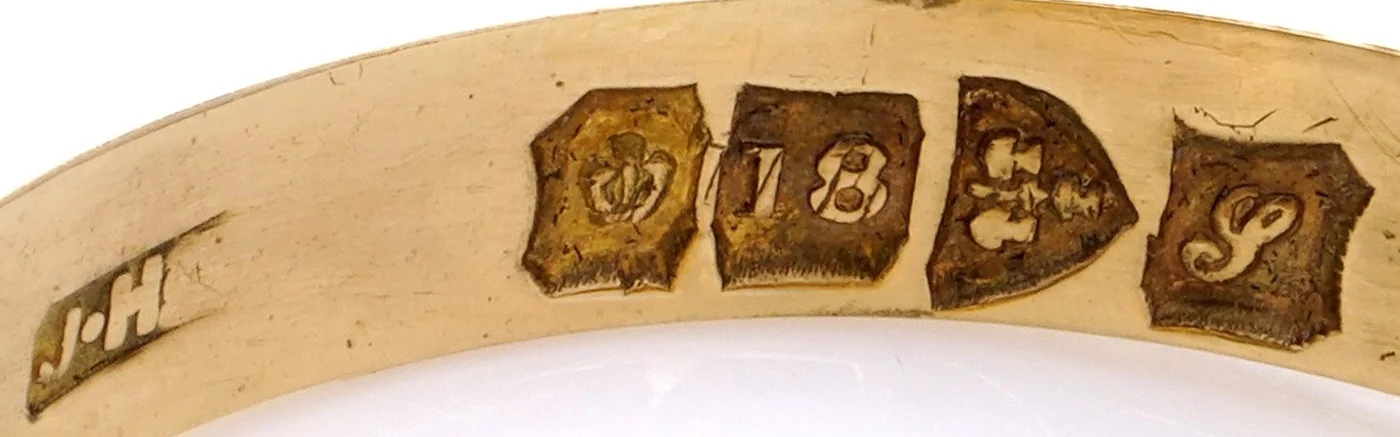 Chester hallmarks for 1918 inside an 18KT gold signet ring: maker's mark JH, crown and 18, the Chester arms and the date letter S