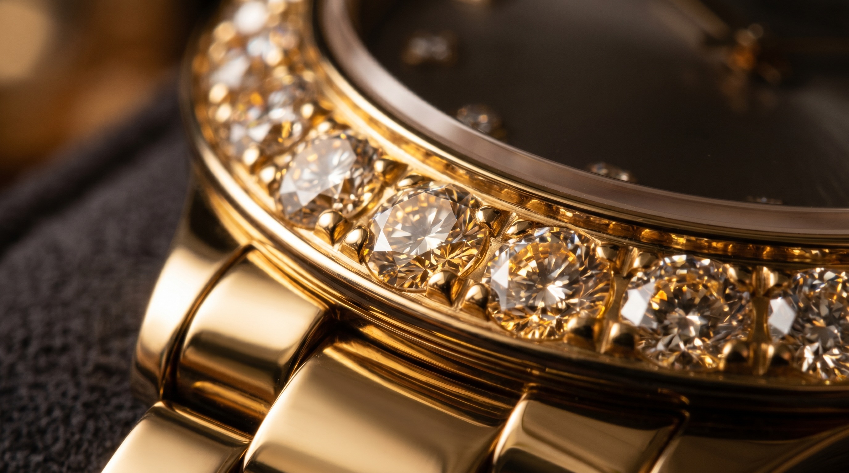 Close-up of polished 18ct gold and brilliant-cut diamonds