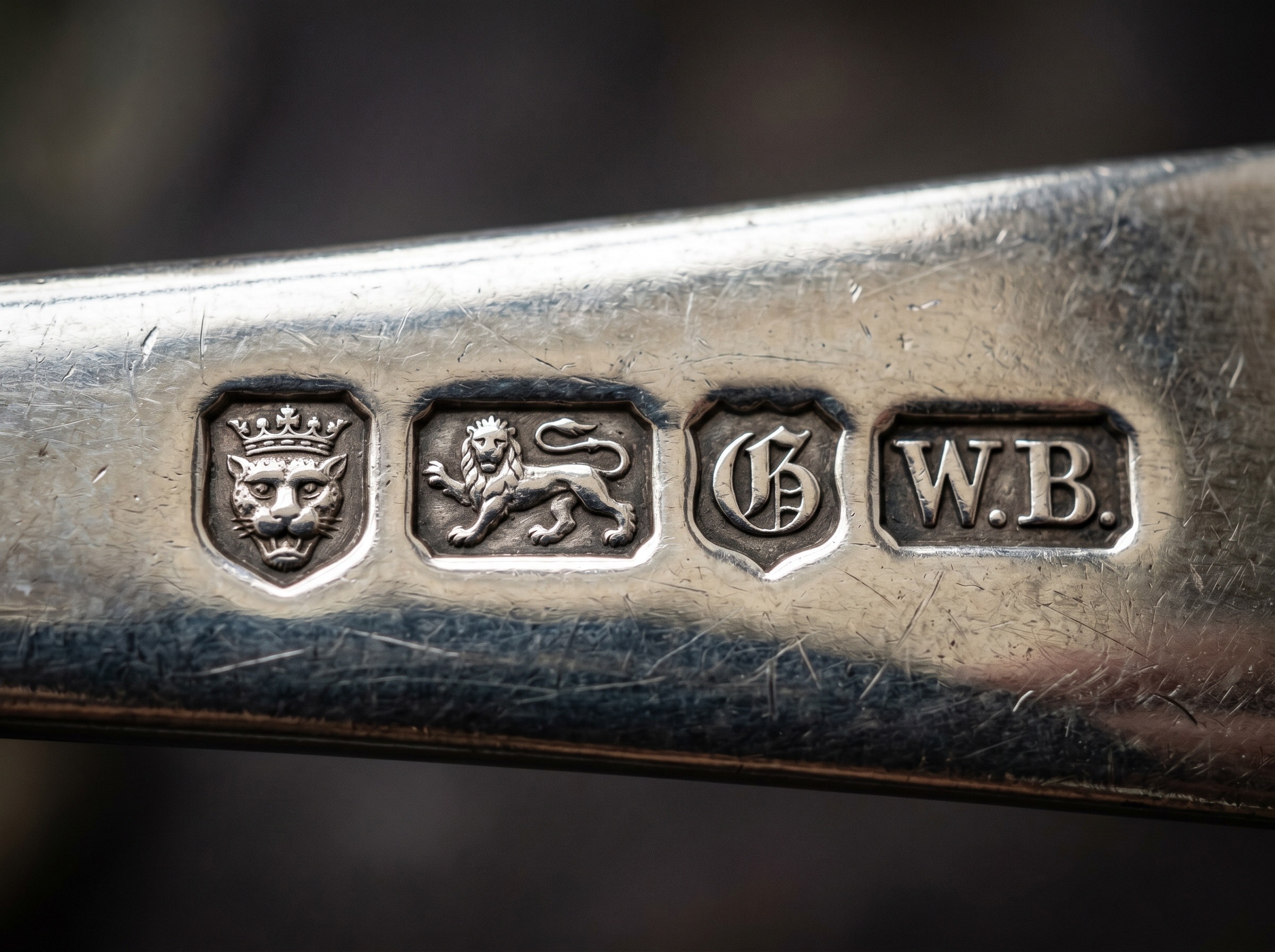 Full row of London hallmarks struck on antique sterling silver — leopard's head, lion passant, date letter and maker's mark