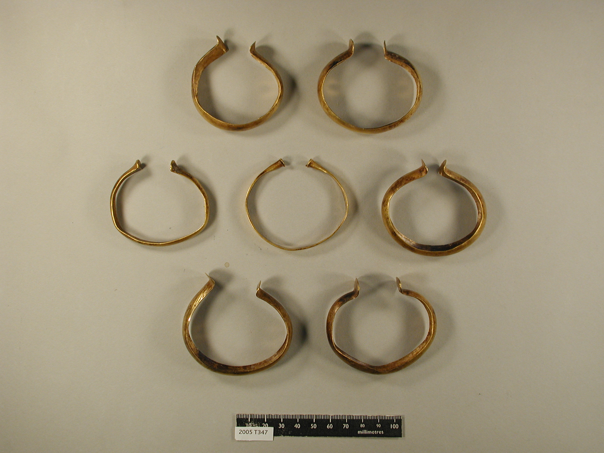 Seven Late Bronze Age gold bracelets found near Bawdeswell, Norfolk, and recorded as Treasure case 2005 T347