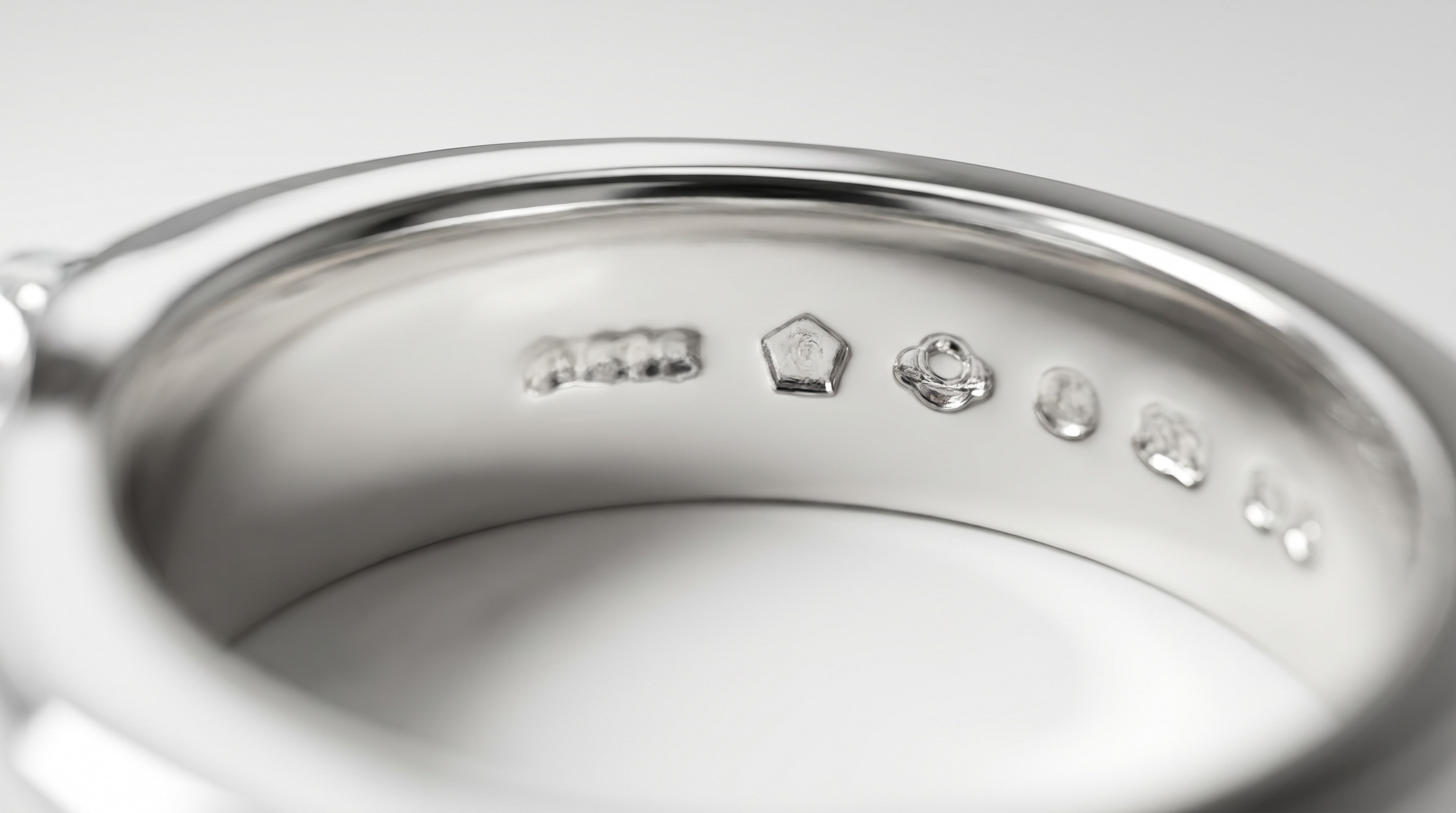 UK platinum hallmarks inside a ring band — fineness, orb and assay marks — Mozeris Fine Antiques