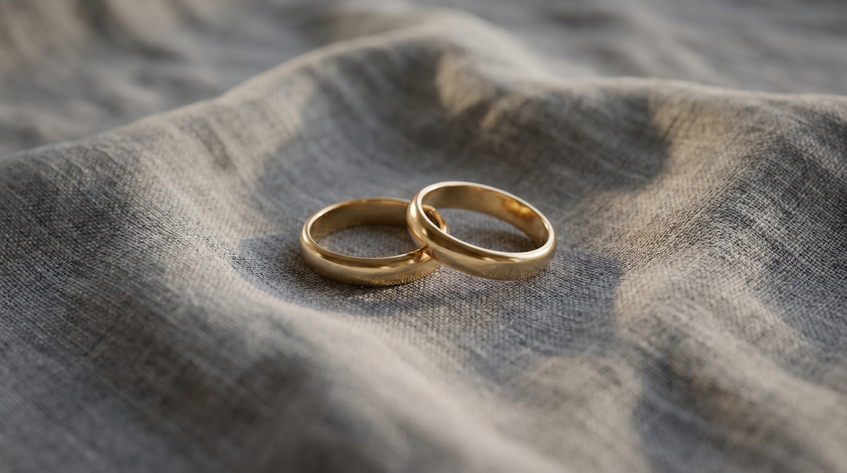 Two gold wedding bands resting together