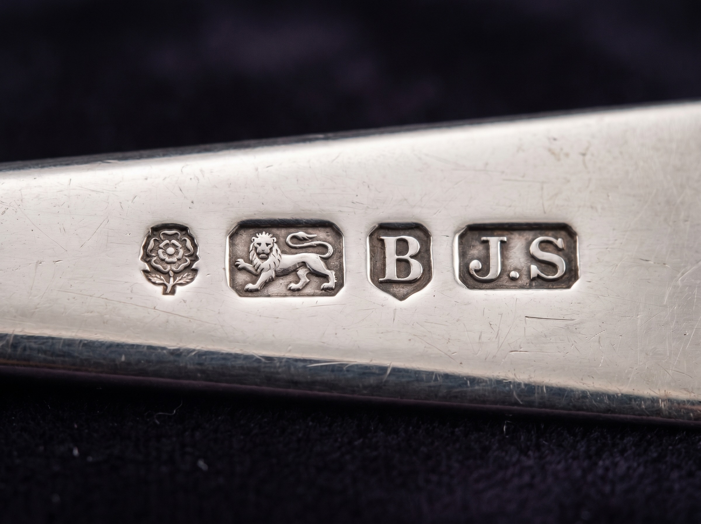 Full row of Sheffield hallmarks struck on antique sterling silver — rose (town), lion passant, date letter and maker's mark